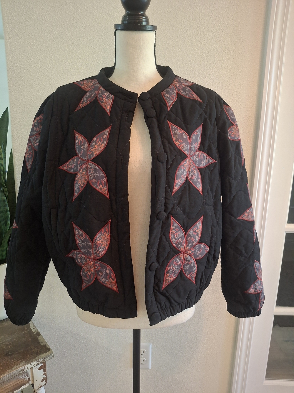 Black Quilted Quinn Bomber Jacket with Red Floral Star Appliqués